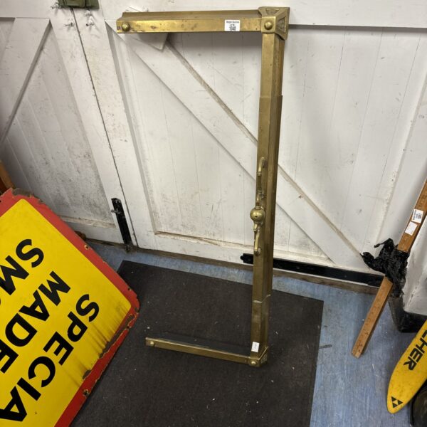 Ornate vintage brass fire surround with decorative detailing.