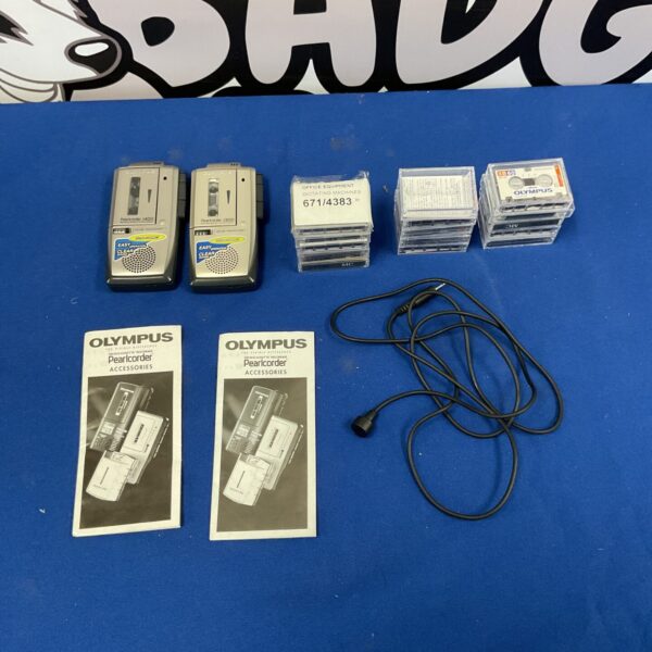Vintage Olympus micro cassette recorder with tapes and microphone.