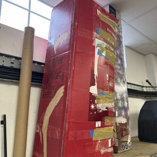 Boxed artificial Christmas tree for holiday decorations.