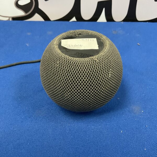 Apple HomePod smart speaker in a modern home setting.