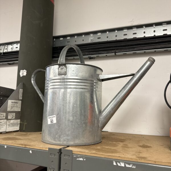 Vintage galvanised watering can for garden use.