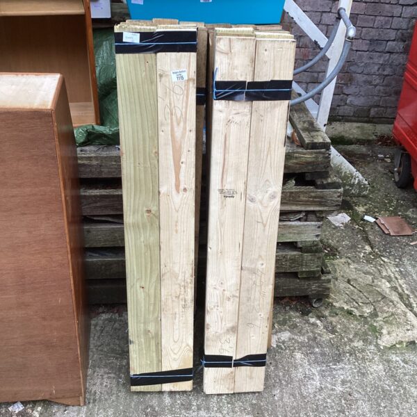 Stack of softwood timber lengths for DIY projects.