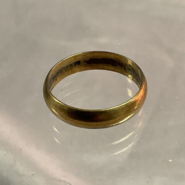 Close-up of a classic 9ct gold band ring.