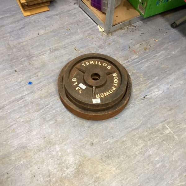 Metal 15 Kilo power weight plate for gym use.