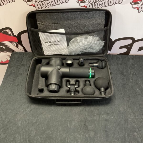 Handheld massage gun with multiple attachments for muscle recovery.