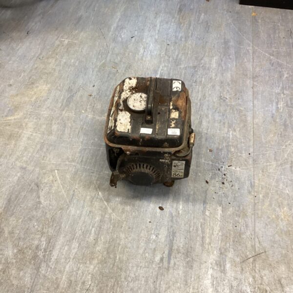 Close-up of the petrol generator engine, showing its condition.