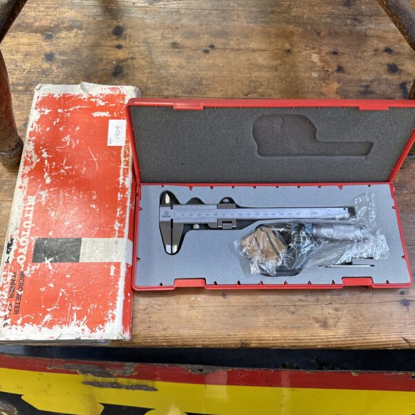 Mitutoyo vernier gauge set in a case, precision measuring tool.