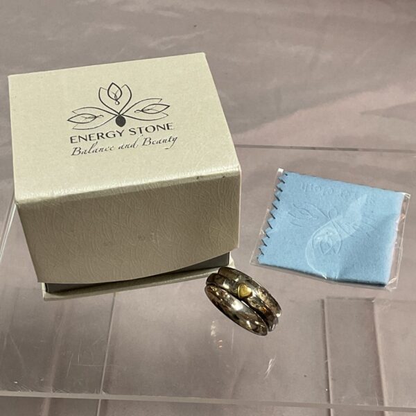 Silver spinner ring by Energy Stone, size W.