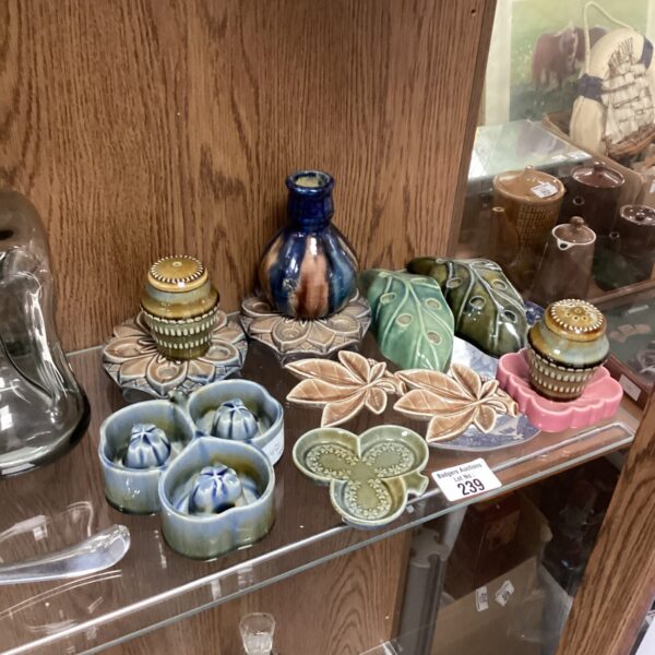 Vintage Irish porcelain collectibles displayed on a shelf.