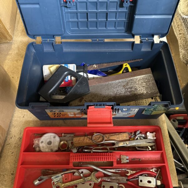 Open Zag plastic toolbox filled with various hand tools.