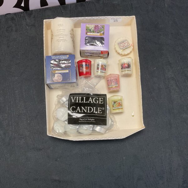 Box of assorted scented candles including M&S brands.