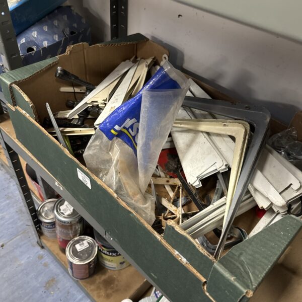 Tray of assorted metal hanging brackets for DIY projects.