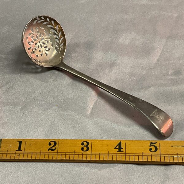 Antique Georgian silver sugar sifter spoon with pierced bowl.
