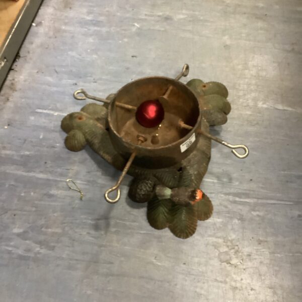 Vintage cast iron Christmas tree stand with leaf detailing.
