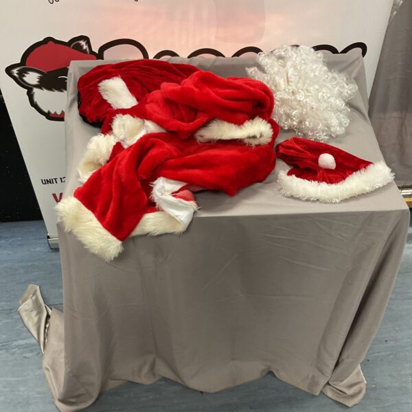 Box containing a complete Santa Claus outfit for Christmas.