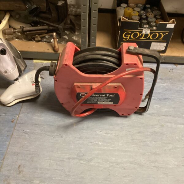 Universal Tool hydraulic hose reel in a workshop setting.