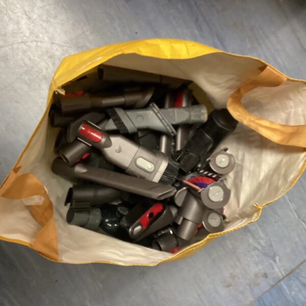 Mixed lot of genuine Dyson vacuum cleaner nozzles and attachments.
