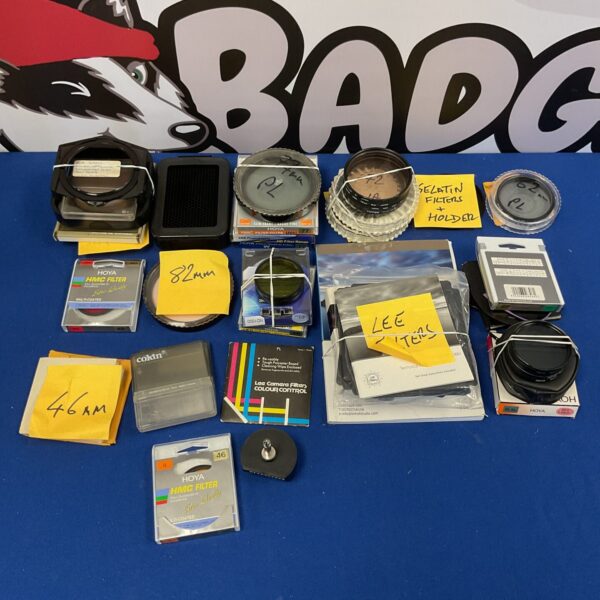 Assorted vintage camera filters including Hoya and gelatin examples.