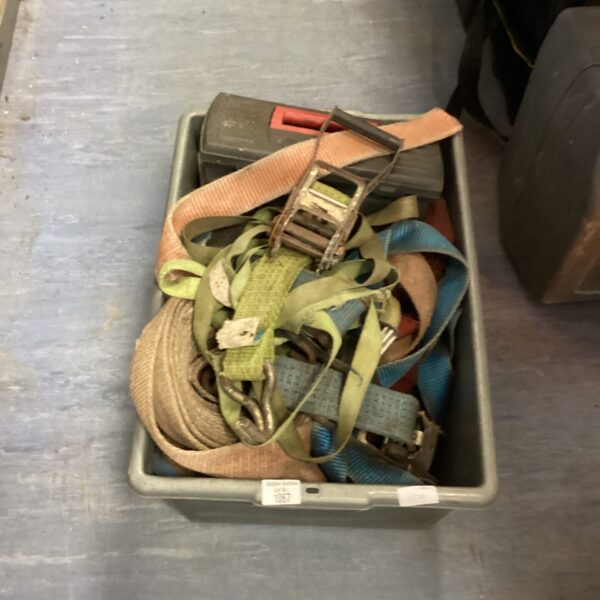Mixed lot of used ratchet straps and webbing for securing loads.