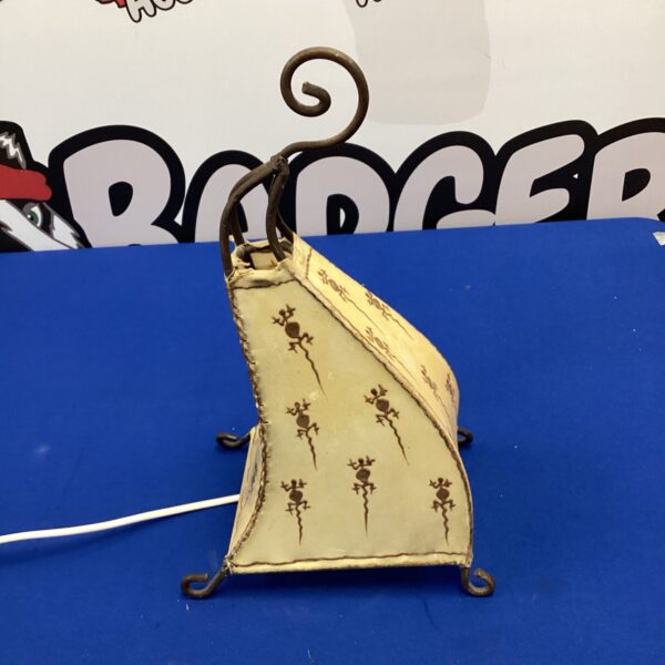 Vintage Aboriginal table lamp with hide shade and root base.