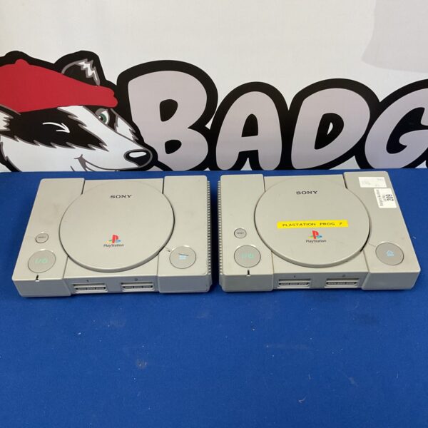Two grey Sony PlayStation One consoles for retro gaming