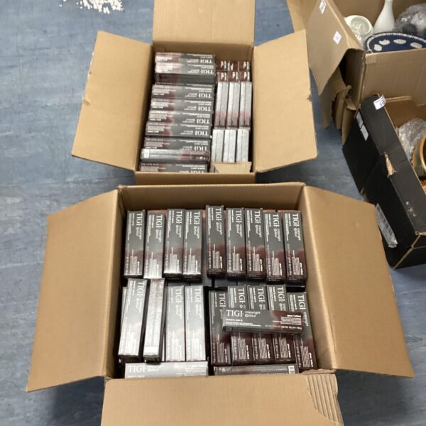 Sealed boxes of Tigi hair dye for professional hair coloring.