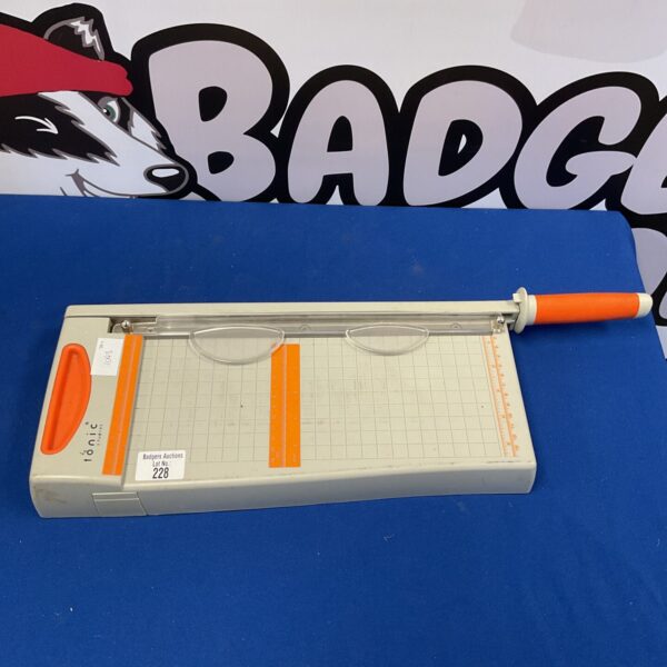 Tonic Studios paper guillotine for crafting and precise paper cutting.