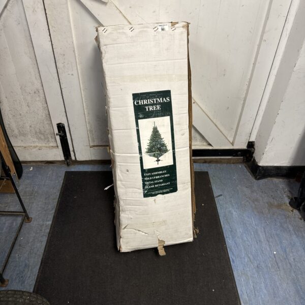 Unopened box of a 7.5ft artificial Christmas tree for holiday decor.