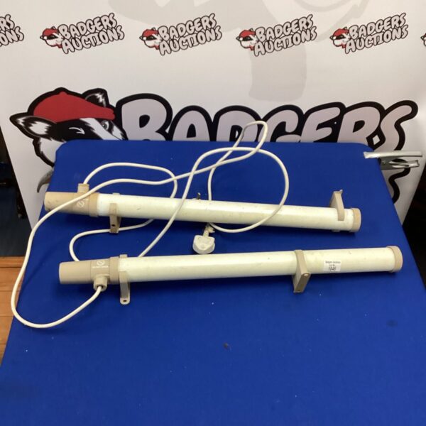 Pair of white electric greenhouse heaters for plant warmth.