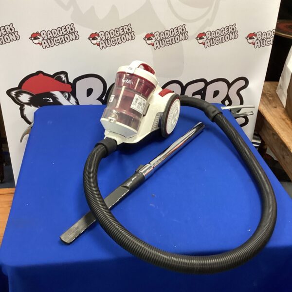 Vintage Goblin vacuum cleaner with hose attachment.