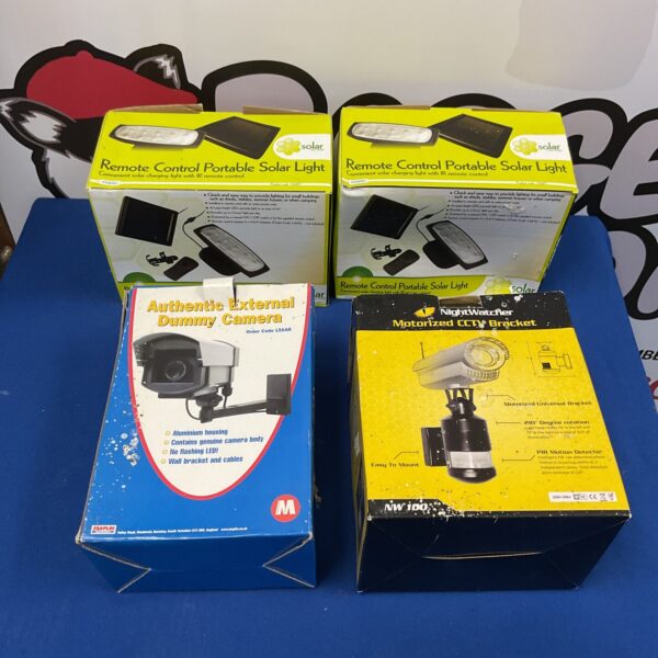 Two solar powered dummy CCTV cameras with brackets for outdoor security.