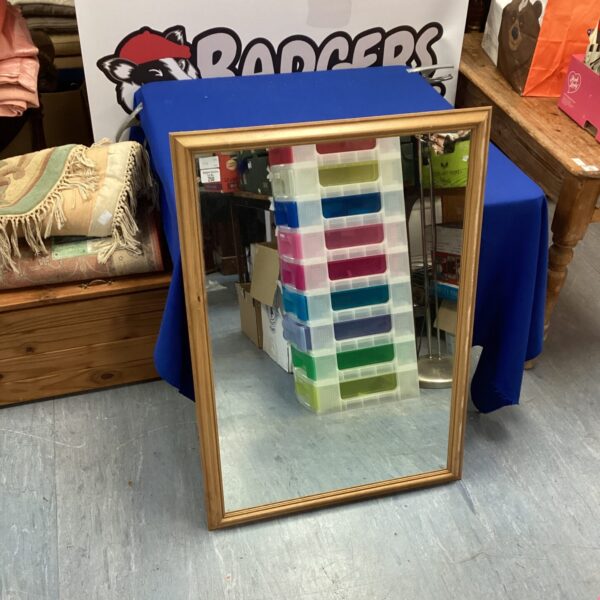 Vintage wood framed mirror measuring 40x27 inches for home decor.
