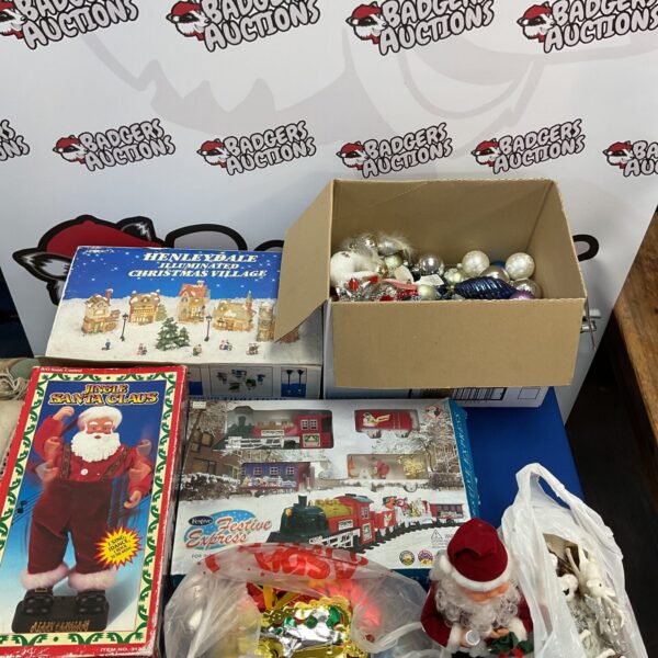 Assorted Christmas decorations including a dancing Santa and train set.