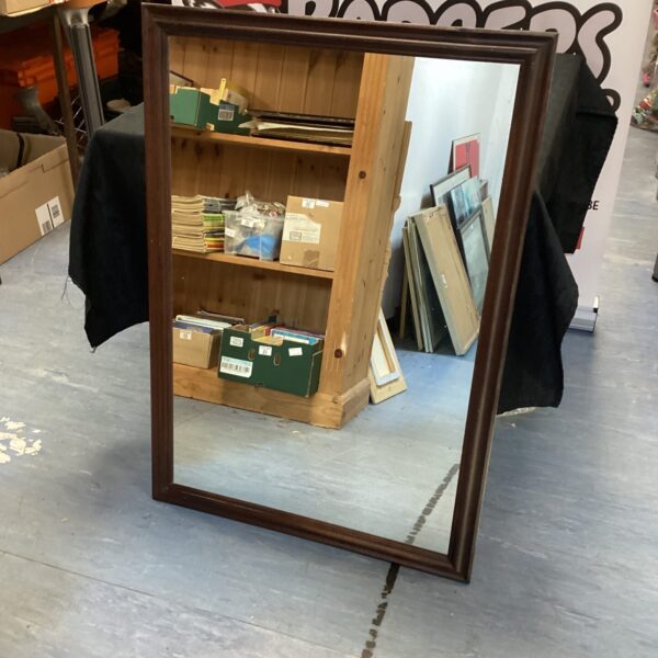 Vintage wood framed mirror measuring 39x27 inches.