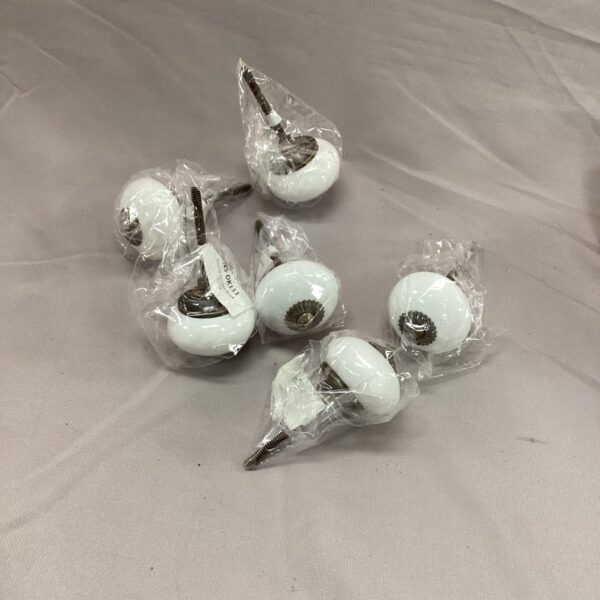 Vintage porcelain drawer knobs for cabinet and furniture restoration.