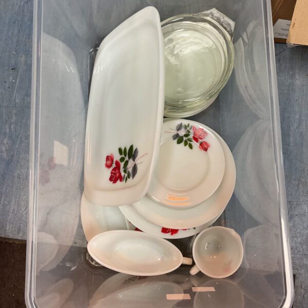 Vintage porcelain serving set with floral pattern and gravy boat.