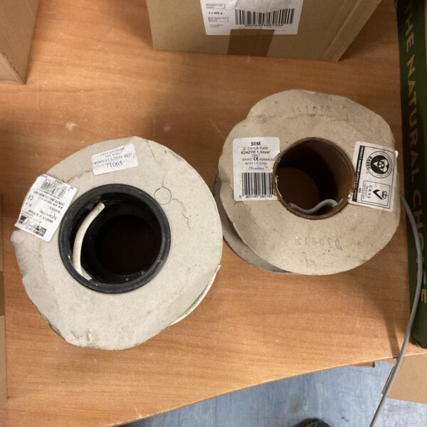 Two reels of industrial electrical cable for wiring projects.