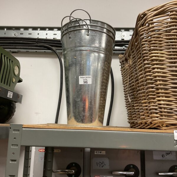 Vintage galvanized steel bucket with handle, rustic farmhouse style.