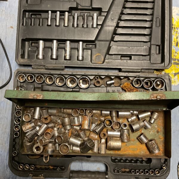 Assorted socket set in a metal tray, mechanic's tools.