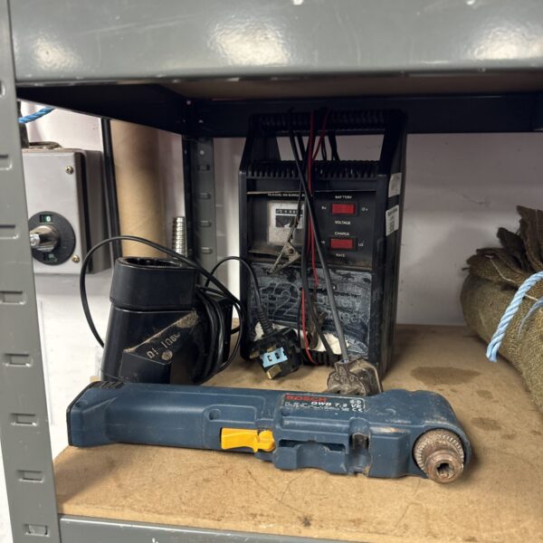 Bosch cordless screwdriver with 12v battery charger, vintage power tool.