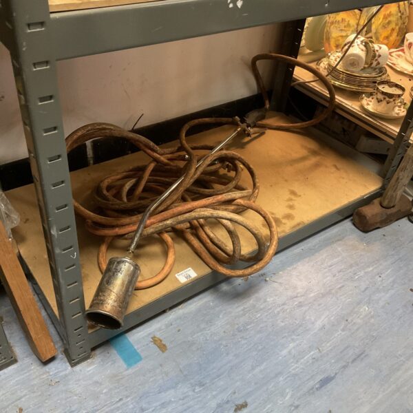 Vintage blowtorch, an antique plumbing and metalworking tool.