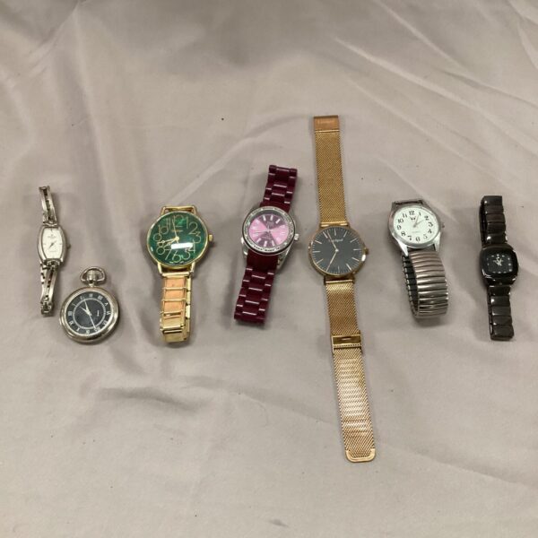 Group of vintage wristwatches and a pocket watch for collectors.
