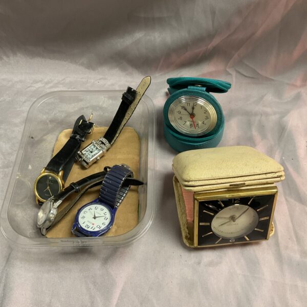 Vintage wristwatches and travel alarm clocks lot for collectors.