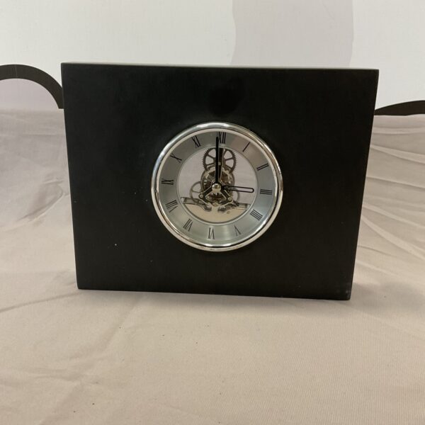 Antique slate skeleton mantle clock with visible mechanism.