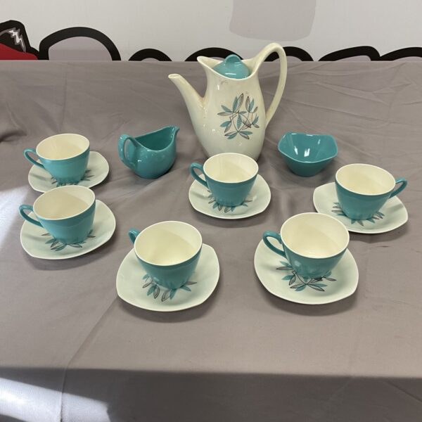 Vintage Midwinter Fashion Shape coffee set displayed on a grey surface.