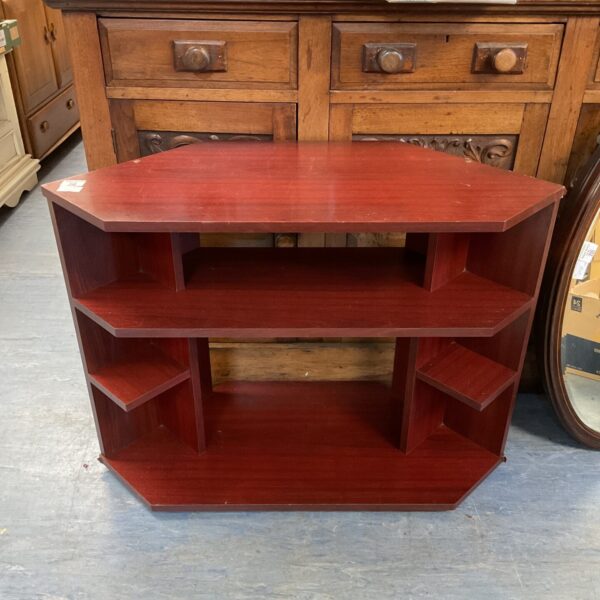 Vintage mahogany corner TV cabinet with tiered shelves.