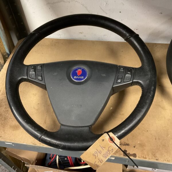 Saab 9-3 steering wheel with integrated controls for volume.