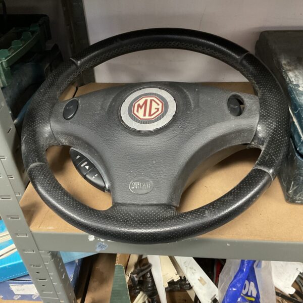 Classic MG steering wheel for vintage car restoration.