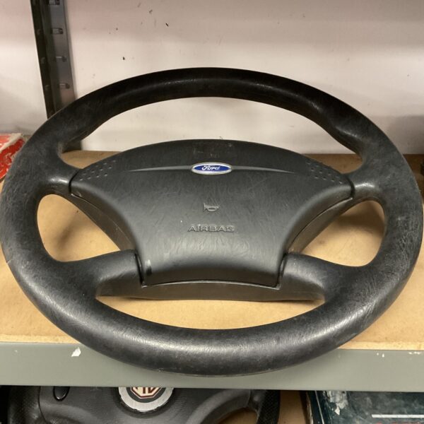 Used Ford car steering wheel with airbag provision.