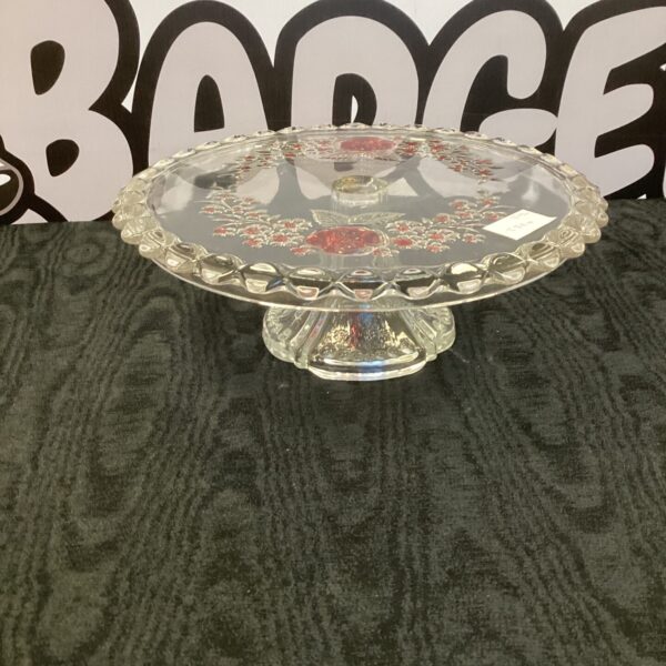 Elegant vintage crystal cake stand with tiered design for desserts.